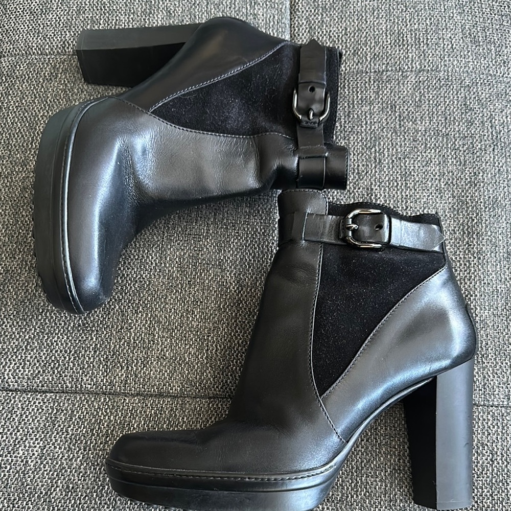 Tod's Black Ankle Boots with Sleek Design and Metallic Buckle